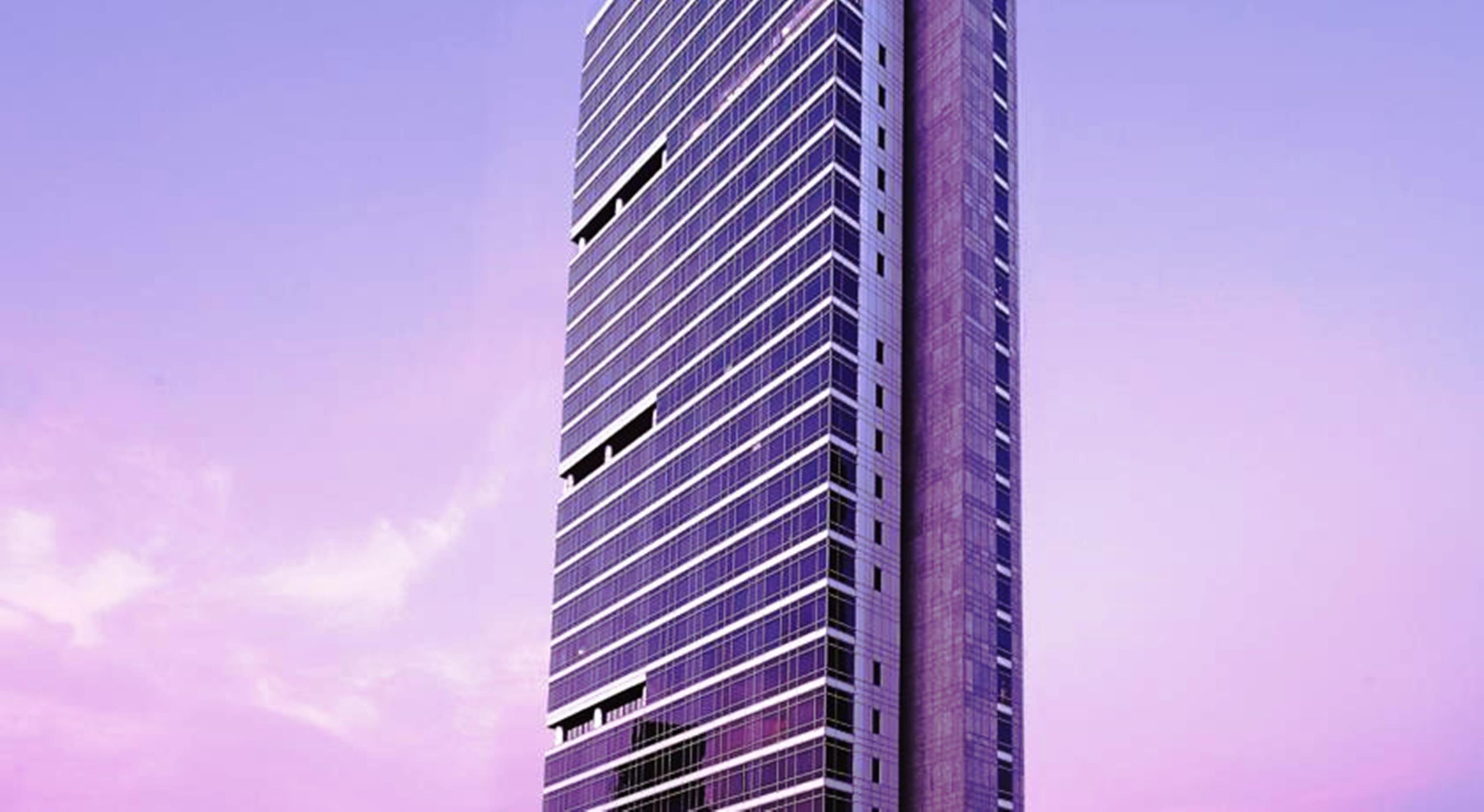 Four Seasons Hotel Мумбаи Экстерьер фото The building at dusk